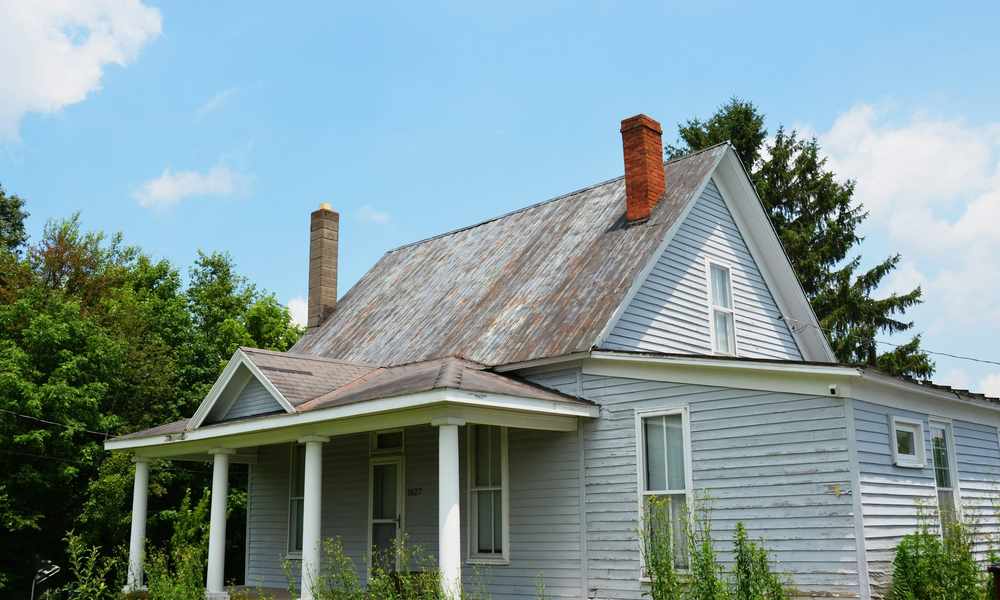 Siding in need of repair on a home exterior
